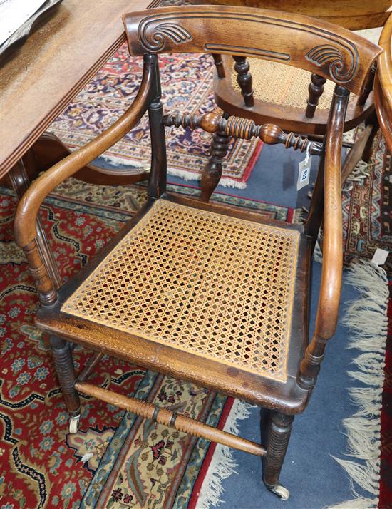 A Regency provincial cane seat elbow chair